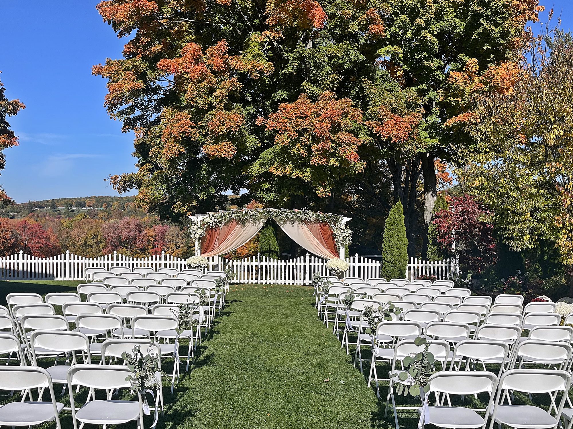 Pergola_with_real_floral_and_draped_fabrics_GHCC_Mums